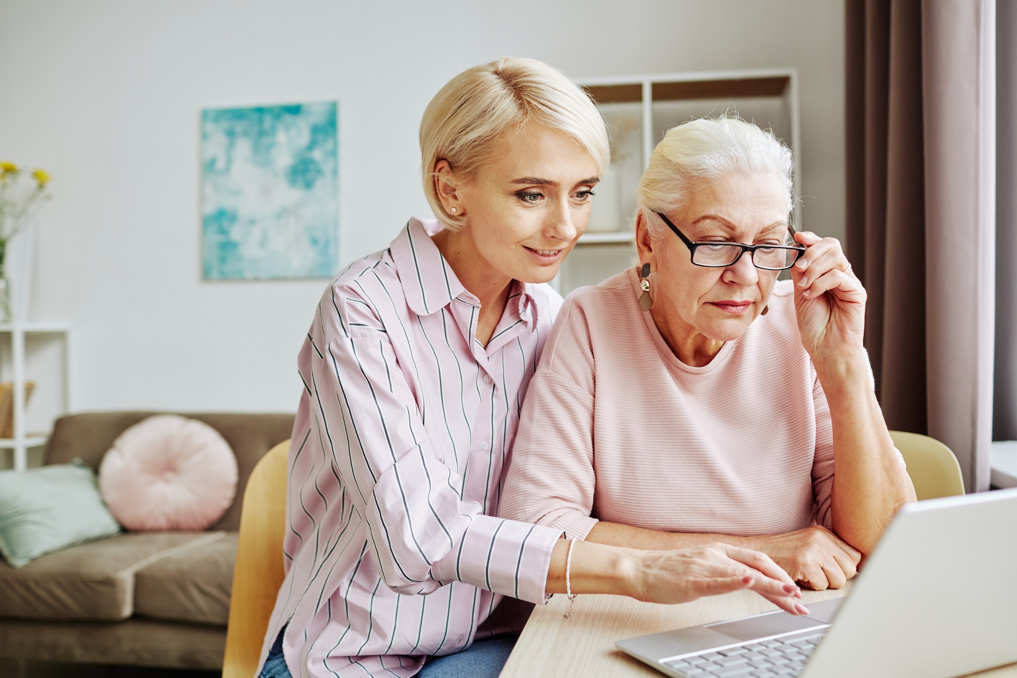 Daughter Helping Senior Woman with Computer
