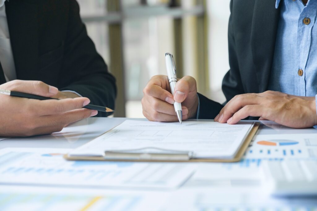 Business man sign a contract investment professional document agreement.